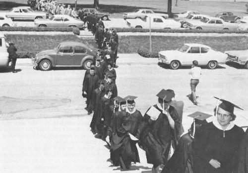 Line of graduating students first graduation